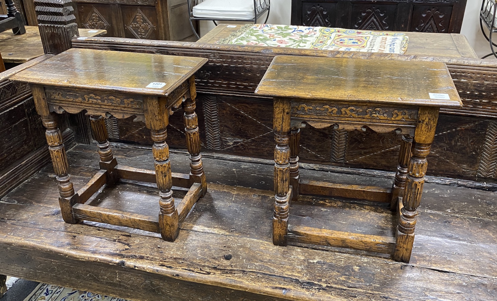 A pair of 17th century style rectangular carved oak joint stools, width 46cm, depth 28cm, height 47cm